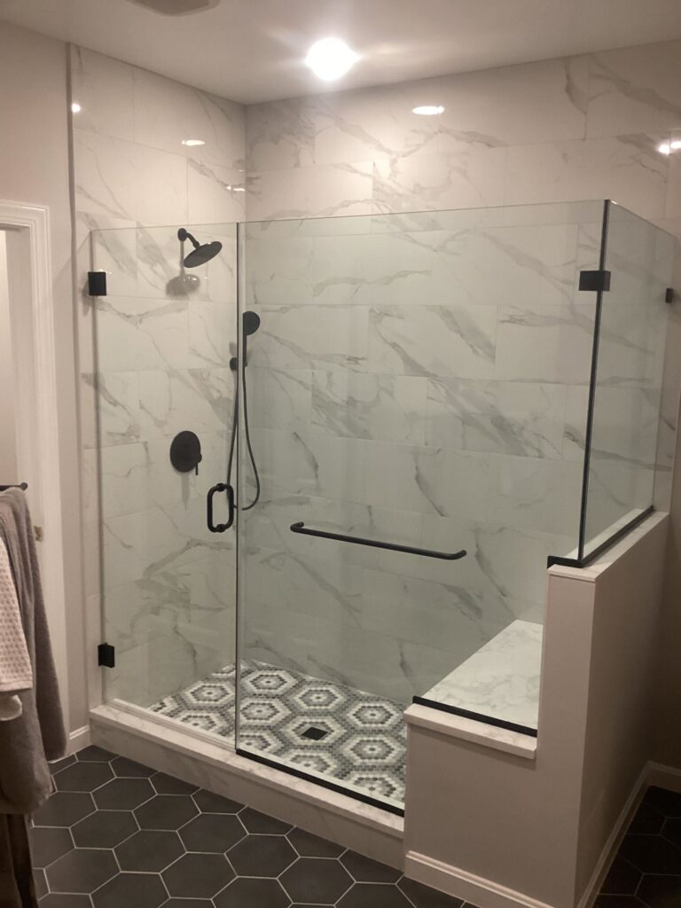 frameless glass corner shower door in Gaithersburg, MD with bench seat