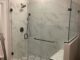 frameless glass corner shower door in Gaithersburg, MD with bench seat